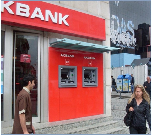 Illuminated bank brand signage on building facade