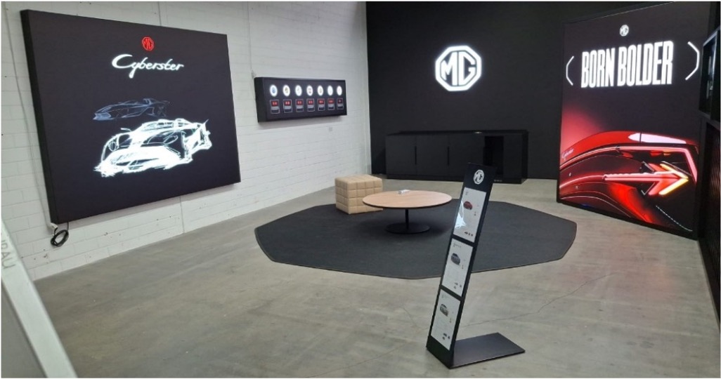 Branded wall graphics and vehicle presentation zone