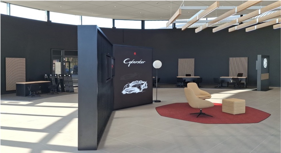 Exterior facade with illuminated MG branding