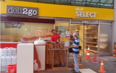 Illuminated canopy with brand identity